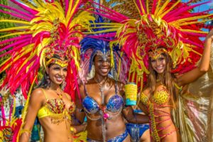 3 women in costumes for Trinidad Carnival