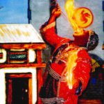 Tunka Abdurama placing a rod lit with fire in his mouth and holding fire in his hands