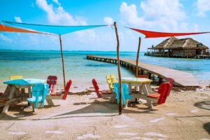 Colourful chairs and table on a beach in Belize