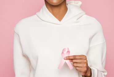 lady holding cancer ribbon