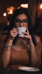 woman drinking from a teacup