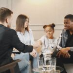 little girl shaking hands