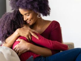 mother hugging daughter