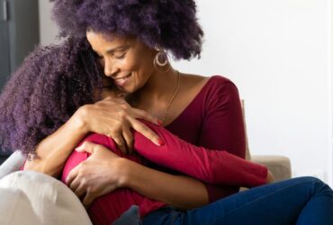 mother hugging daughter