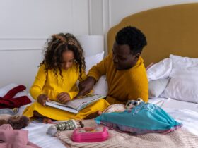 father helping child with homework