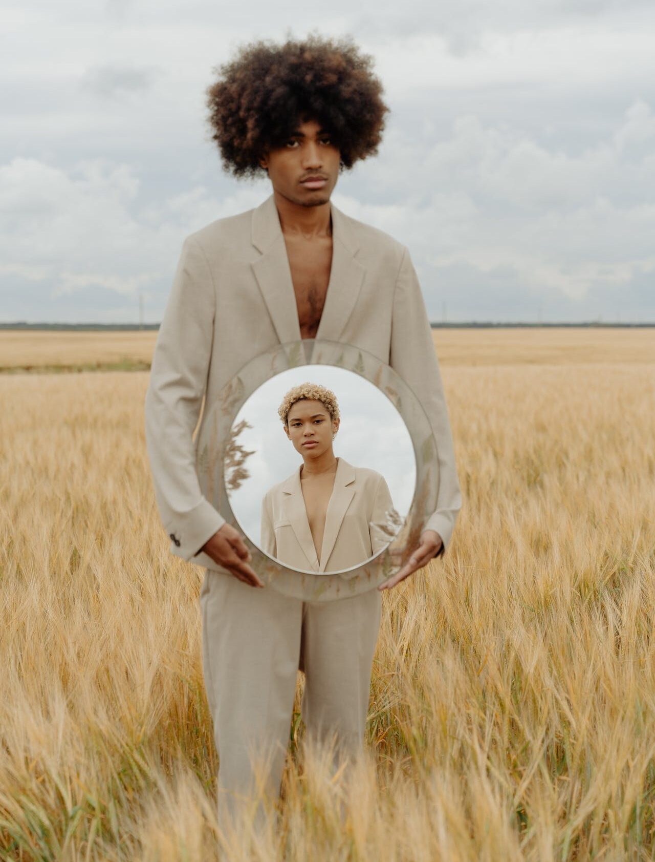 man holding mirror which reflects his ex face