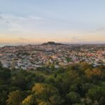 Aerial view of the cityscape of San Fernando against the dusk sky at sunset in Trinidad and Tobago