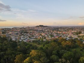 Aerial view of the cityscape of San Fernando against the dusk sky at sunset in Trinidad and Tobago