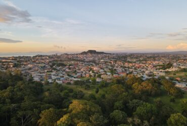 Aerial view of the cityscape of San Fernando against the dusk sky at sunset in Trinidad and Tobago