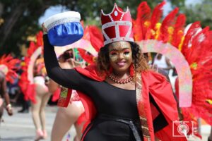 Queen Roxxy holding her crown