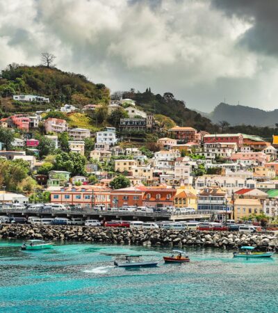 Grenada with boats on the sea and colourful houses in the background