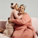 daughter kissing mother