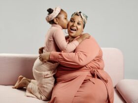 daughter kissing mother